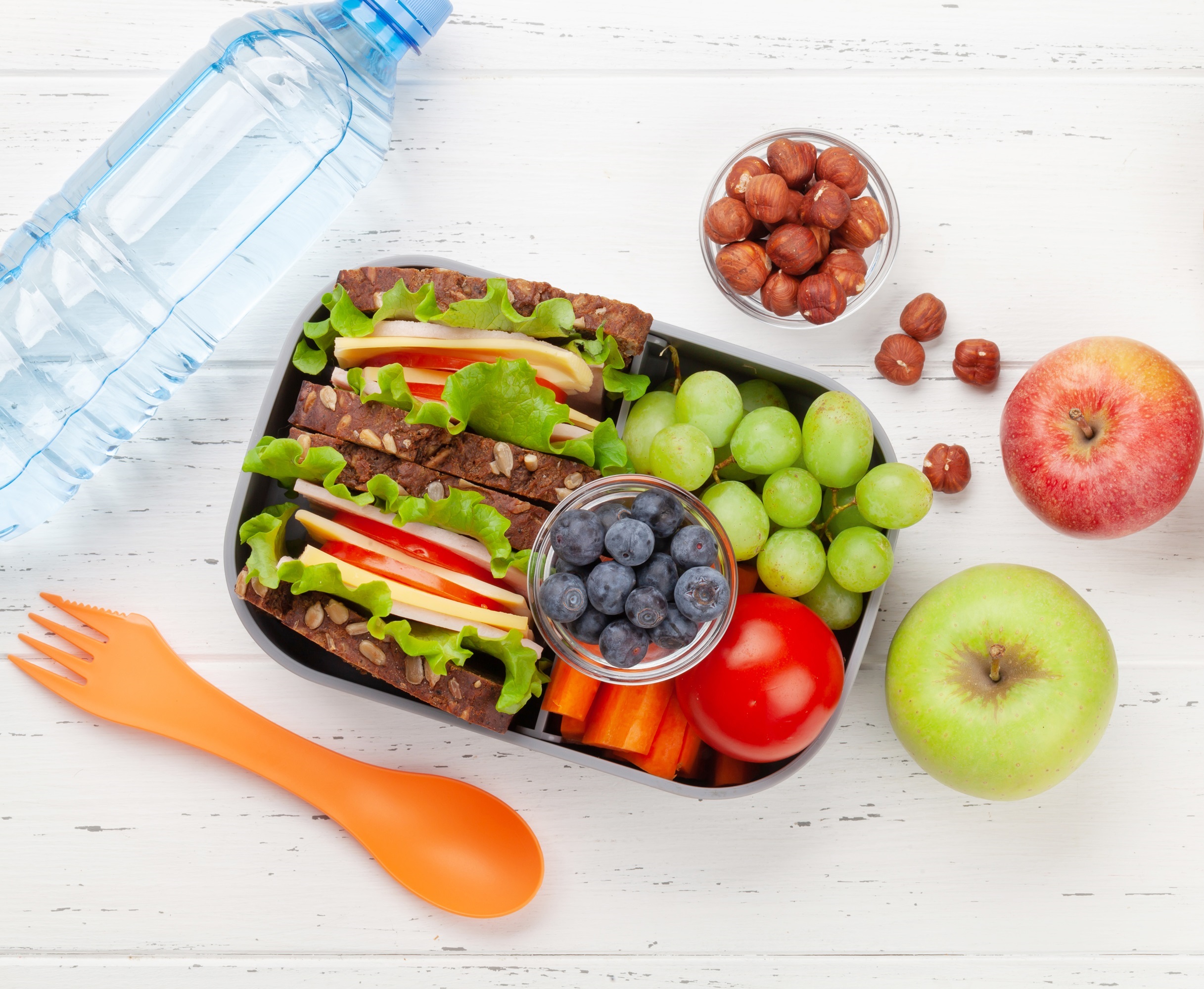 Healthy school lunch box with sandwich and fresh vegetables